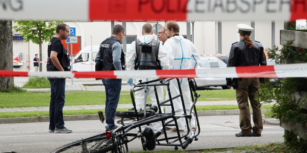 GRAFING, GERMANY - MAY 10:  Forensic specialists of the German police secure the crime scene after a deadly knife attack on May 10, 2016 in Grafing, Bavaria. One person has died and three others have been injured after a man launched a knife attack at Grafing commuter train station that police prosecutors said had 'an apparent Islamist motive'.  (Photo by Johannes Simon/Getty Images)