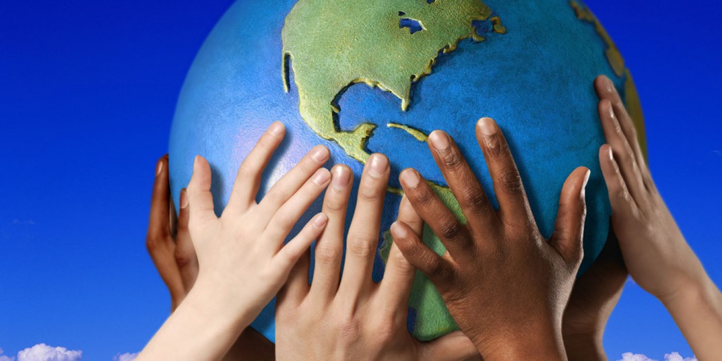 Hands on a globe