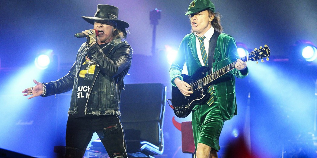 Australian rock band AC/DC's guitarist Angus Young (R) and US singer Axl Rose perform on stage in Vienna, Austria, on May 19, 2016. / AFP / APA / HANS KLAUS TECHT / Austria OUT        (Photo credit should read HANS KLAUS TECHT/AFP/Getty Images)